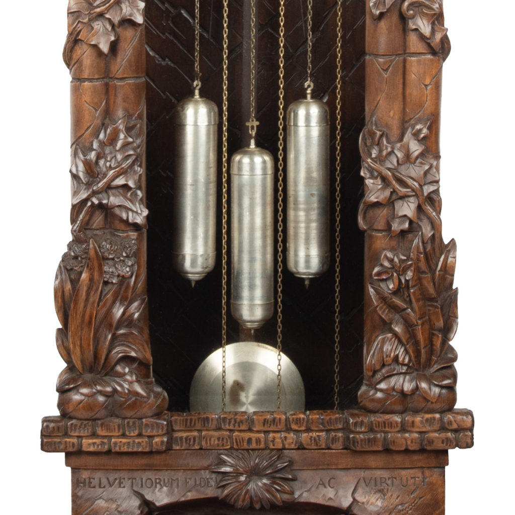 A ‘Black Forest’ linden wood long case clock by Spring of Interlaken ...