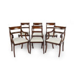 A set of six Regency mahogany sabre leg dining chairs