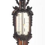 Lord Vernon’s Sudbury Hall lime wood barometer, by J. Braund after Grinling Gibbon