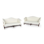 A pair of mahogany sofas from Powderham Castle sofas/settees