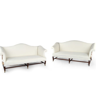 A pair of mahogany sofas from Powderham Castle sofas/settees